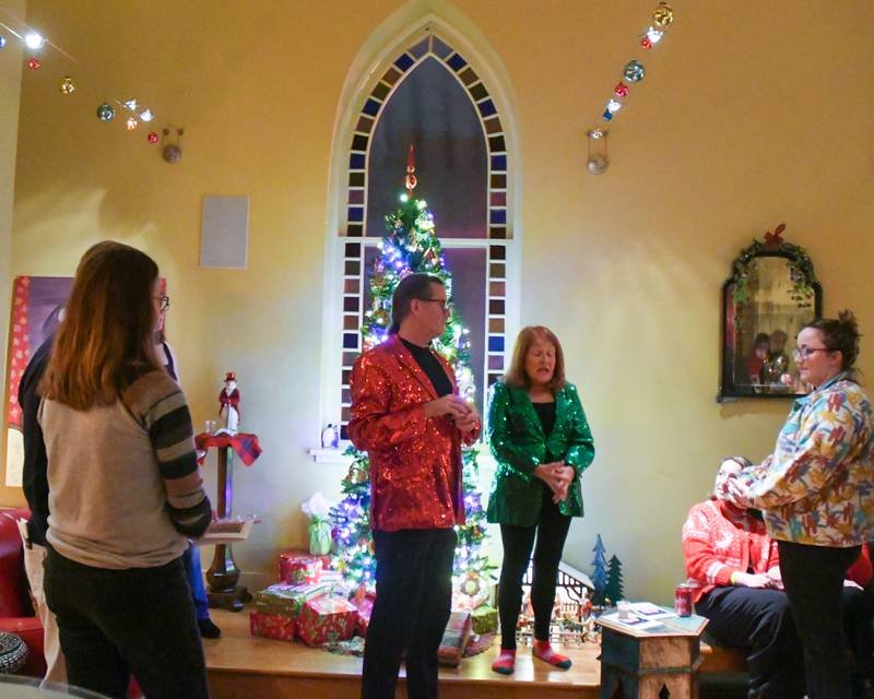 La Grange historical president Katherine Padgett and her husband Marcus welcome community members before touring other homes on the evening of Sunday Dec. 17, 2023, during the Holiday Sip and Sweet Tour event in La Grange.