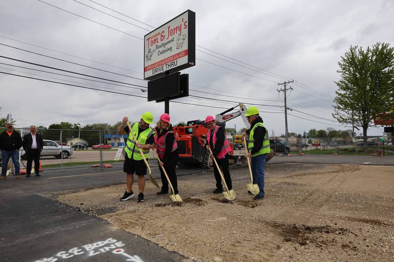Tom & Jerry’s general manager Josh Osenga, (L-R) general manager Sarah Meyer, owner Diann Beaulieu and owner Thomas Beaulieu prepare to scoop up some dirt Friday, May 1, 2026, during a groundbreaking ceremony to kick off the rebuilding of the restaurant at its previous location of 1670 DeKalb Avenue in Sycamore. Tom & Jerry’s was destroyed by a fire on January 31 and is currently operating at its temporary location at 265 West Peace Road in Sycamore.