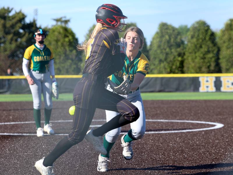 Coal City's Addison Harvey loses the ball as she reaches to tag Herscher's Lexi Crawford during Coal City's 14-10 victory over Herscher on Monday, April 20, 2026.