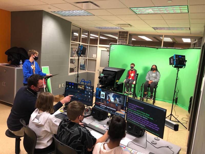 Students involved with Tiger TV at Hickory Creek Middle School in Frankort are seen at their first training session. Pictured is Samuel Vondrak (standing, blue sweatshirt) and, from left, Fletcher Shank, and Amerie Green (sitting in front of the green screen). Sitting at the computer desk are, from left, Dave Wonder, Genna Kruger, Brenden Christoff and Alaina Steele.