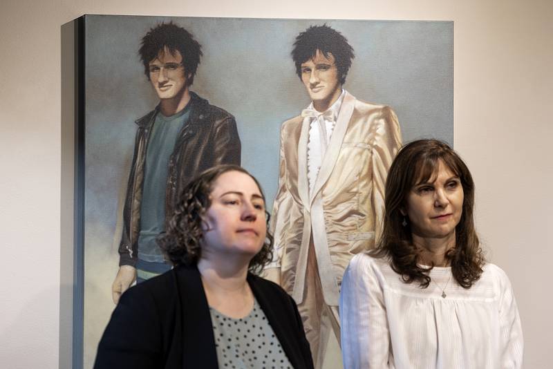 Sauk Valley Community College instructors Amy Jakobsen (left) and Karen Abele attend the closing of artist Deborah Di Vita Glascott’s show “13 Stories,” Monday, March 20, 2023 at the SVCC art gallery.