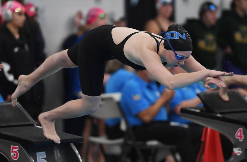 St. Charles North’s Kate Farrell leaves the starting block in the 500-yard freestyle during the girls state swimming preliminaries at the FMC Natatorium on Friday, Nov. 14, 2025 in Westmont.