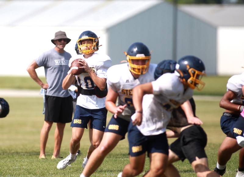 Sterling’s Brady Berlin looks to throw the ball during a joint practice with Glenbard South and Oswego East football teams on Tuesday, July 15, 2025 in Oswego.