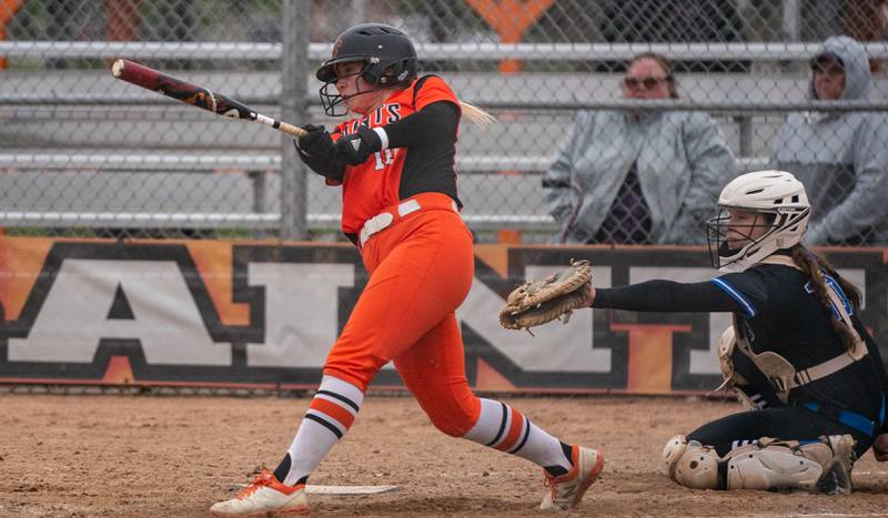 St. Charles East's Izzy Howe (10) singles against St. Charles North during a softball game at St. Charles East High School on Monday, April 25, 2022.
