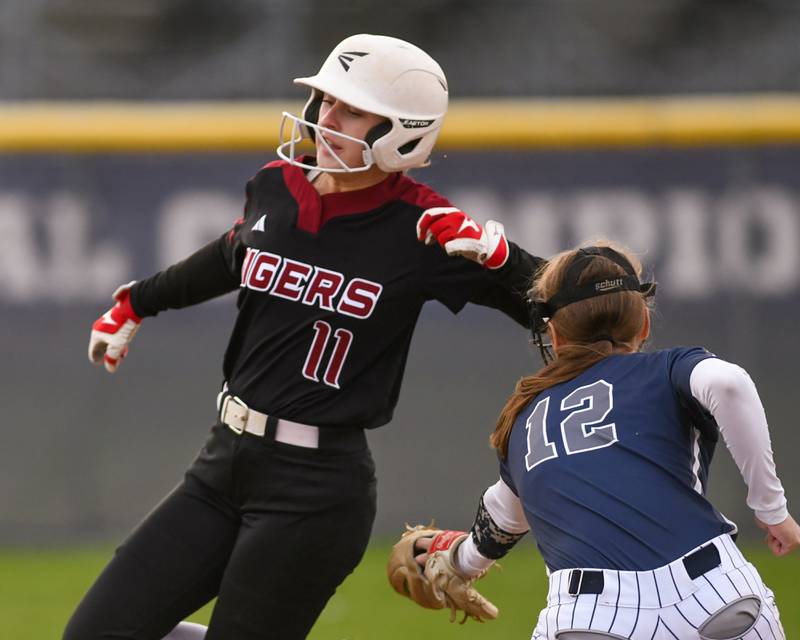 Plainfield North’s Sydney Sullivan (11) gets around the game of Oswego East’s Kaitlyn Maday during the game on Thursday April 17, 2025, held at Oswego East High School.
