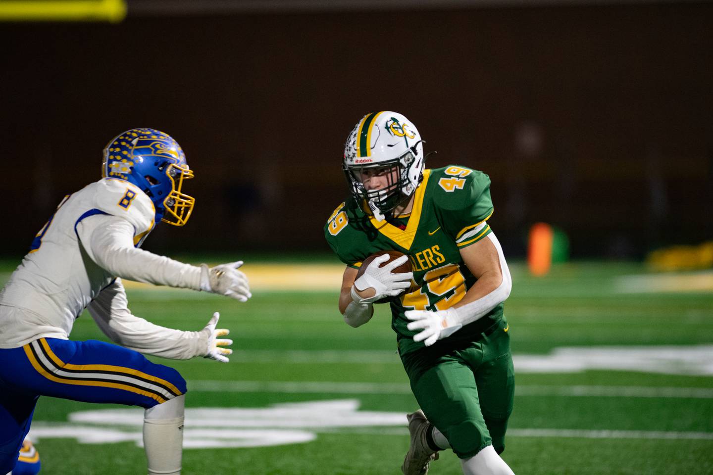Coal City's Logan Natyshok dodges Johnsburg's Shawn Hallpran during the first round IHSA class 4A playoffs on Friday Nov. 1, 2024 at Coal City High School