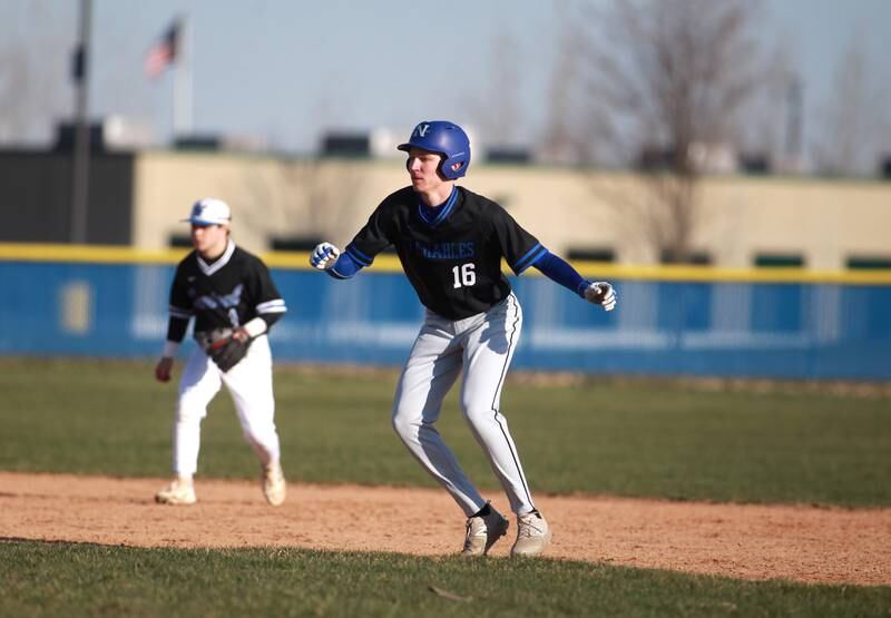St. Charles North’s Henry Grimm leads off from second base during a game on Tuesday, April 8, 2025 at Burlington Central.