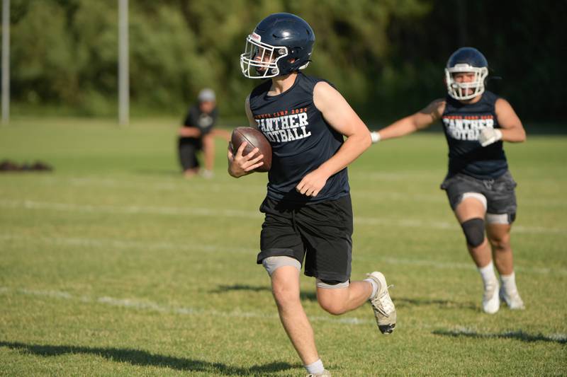 Oswego runs back an interception against Kaneland during a 7 on 7 football in Maple Park on Tuesday, July 12, 2022.