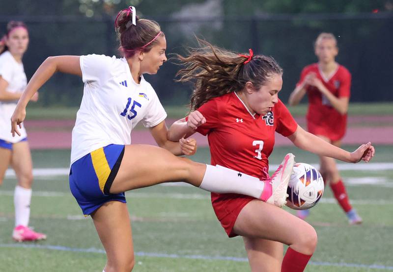 Johnsburg's Lauren McQuiston (left) tries to kick the ball by Timothy Christian's Kate Gagliano Thursday, June 5, 2025, during their IHSA Class 1A state semifinal at North Central College in Naperville.