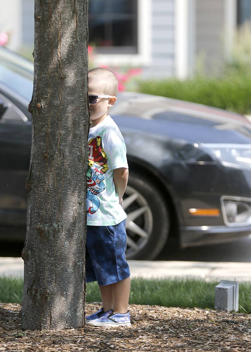 Jackson Graff, 4, hides behind a tree Wednesday June, 7, 2023, while playing hide and seek with his father, Ryan and sister, Madison, 2, around the gazebo in Huntley. I love this photograph because when I saw them playing hide and seek I just found it funny how Jackson was hiding behind a tree and it brought back memories of playing hide and seek with my children.