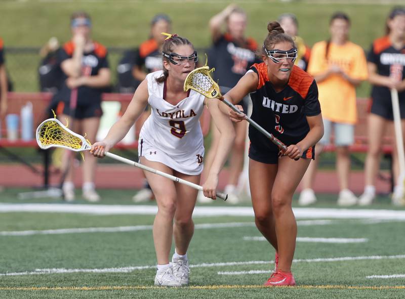 Crystal Lake Central Coop's Fiona Lemke (9) waits for the faceoff against Loyola Academy's Molly Dwyer (9) during the lacrosse state semi-final match between Crystal Lake Central and Loyola Academy on Thursday, June 5, 2025 in Hinsdale.