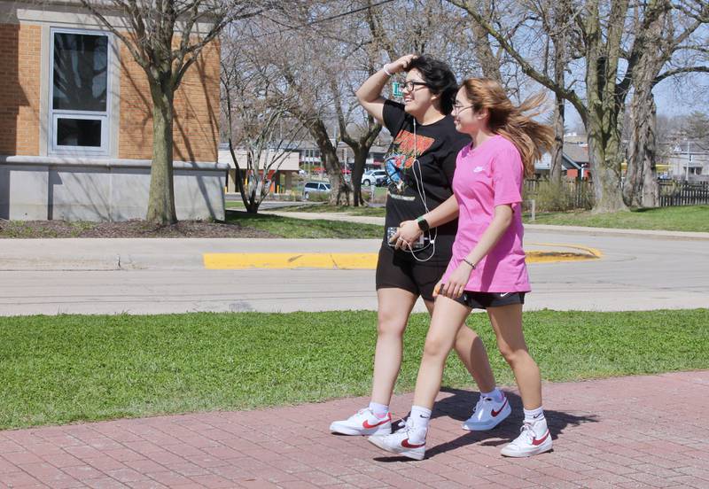 From left, Ashleyn Zarate, 17, and Juli Vargas, 15, walk along the pedestrian and bicycle path that runs along President's Park on Tuesday, April 11, 2023. Dixon was awarded a $2.25 million state grant for a bike path extension.