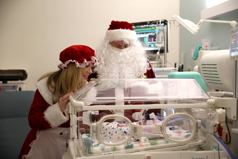 Faye Hodor, just hours old, gets a visit from Santa and Mrs. Claus in the NICU at Northwestern Medicine Central DuPage Hospital in Winfield on Wednesday, Dec. 20, 2023.