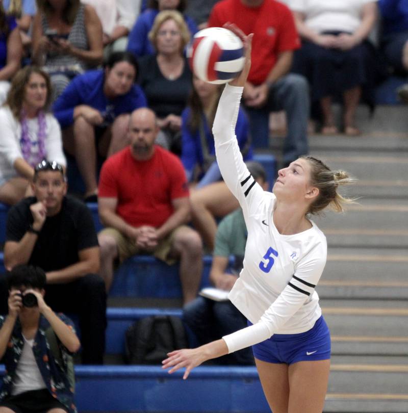 Rosary’s Clare Mceniry goes up for the kill during a game against St. Charles North in Aurora on Monday, Aug. 21, 2023.