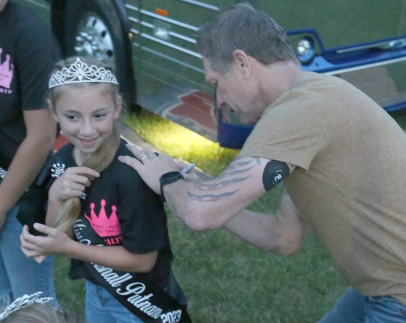 Cooper Martin Little Miss 1st runner-up her her t-shir autographed by Craig Morgan during the 102nd Marshall-Putnam Fair county concert on Thursday, July 13, 2023 in Henry. Morgan autographed all of the royalties shirts before his concert.