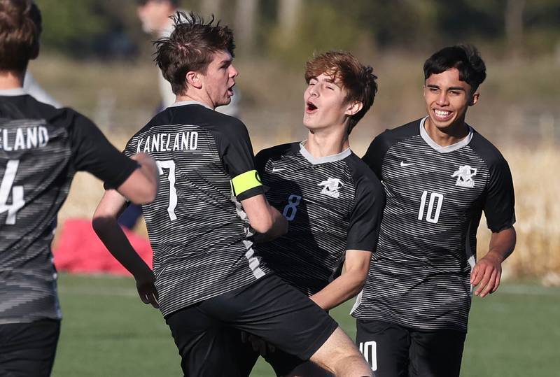 Kaneland players celebrate after scoring the first goal of the game against DeKalb Thursday, Oct. 17, 2024, at Kaneland High School in Maple Park.