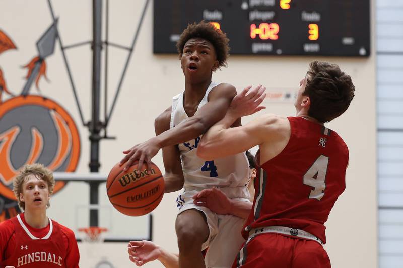 Lincoln-Way East’s BJ Powell finesses a shot against Hinsdale Central in the Lincoln-Way West Warrior Showdown on Saturday January 28th, 2023.