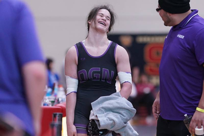 Downers Grove North’s Kayleigh Loo smiles after wining her 170 pound championship match against Maine West’s Lillian Garrett (not pictured) in the Schaumburg Girls Wrestling Sectional at Schaumburg High School on Saturday, Feb 10, 2024.