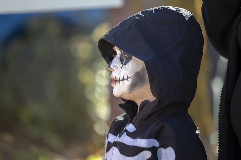 Lurking beneath the black hood is Malcolm Aurand, 5, of Dixon Saturday, Oct. 26, 2024, making his way around the downtown in search of souls….and candy.