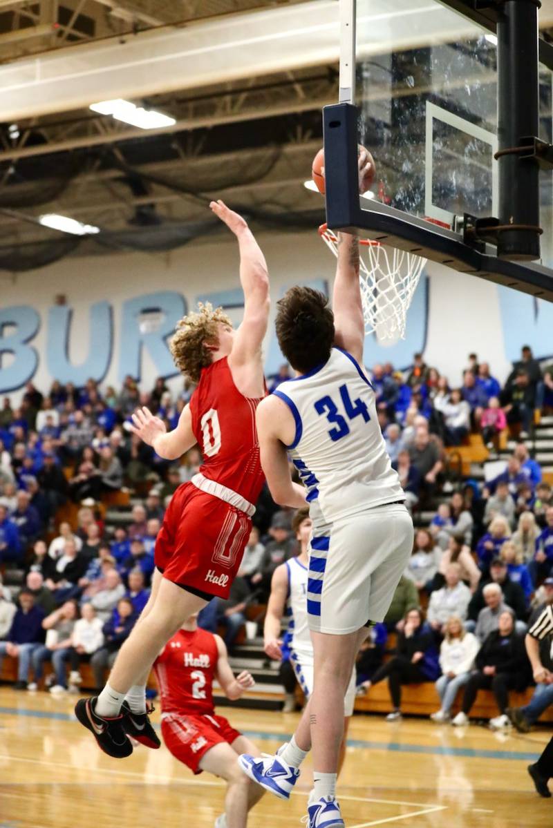 Hall's Mac Resetich soars to block a shot by Princeton's Kolten Monroe Thursday at the Storm Cellar. Princeton won 88-43.