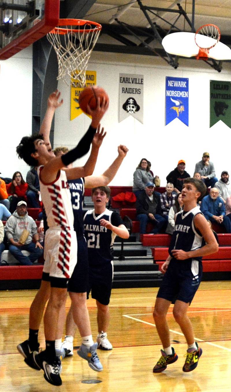 LaMoille's Tyler Billhorn goes in for a reverse layup against Calvary Christian on Wednesday in the LaMoille Holiday Classic. The Lions won 50-47.