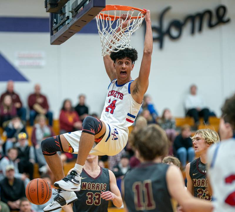 Marmion’s Trevon Roots (24) reacts after dunking the ball against Morris during the 59th Annual Plano Christmas Classic basketball tournament at Plano High School on Tuesday, Dec 27, 2022.