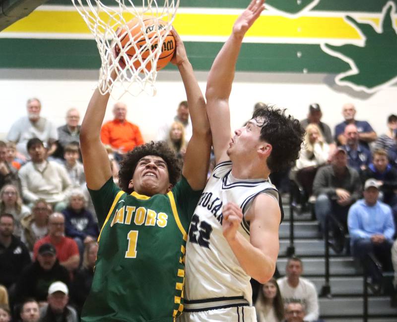 Crystal Lake South’s Noah Cook and Cary-Grove’s Adam Bauer battle at the net in boys IHSA Class 3A Regional Championship basketball on Friday, Feb. 27, 2026, at Crystal Lake South High School in Crystal Lake.