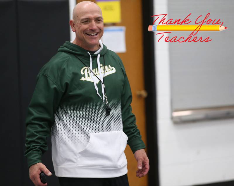 Bill Booker smiles while teaching physical education on March 21, 2023 at Holy Cross School in Mendota.