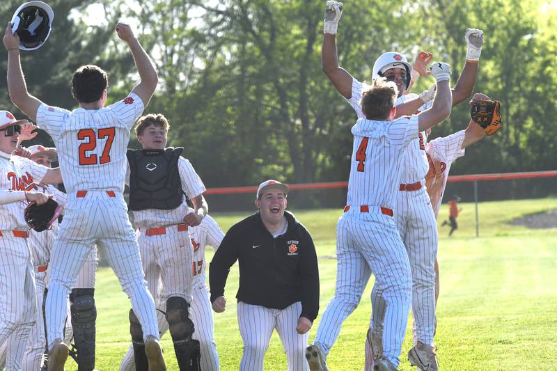 Byron players celebrate after a home run by Dawson Criddle (4) during a 4-run fifth inning against Dixon in a  Big Northern Conference game in Byron on Monday, May 11, 2026.