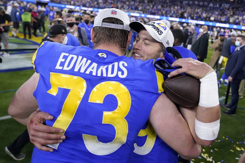 Los Angeles Rams quarterback Matthew Stafford, right, celebrates with David Edwards after the NFC Championship game, Sunday, Jan. 30, 2022, in Inglewood, Calif. The Rams won 20-17 to advance to the Super Bowl.