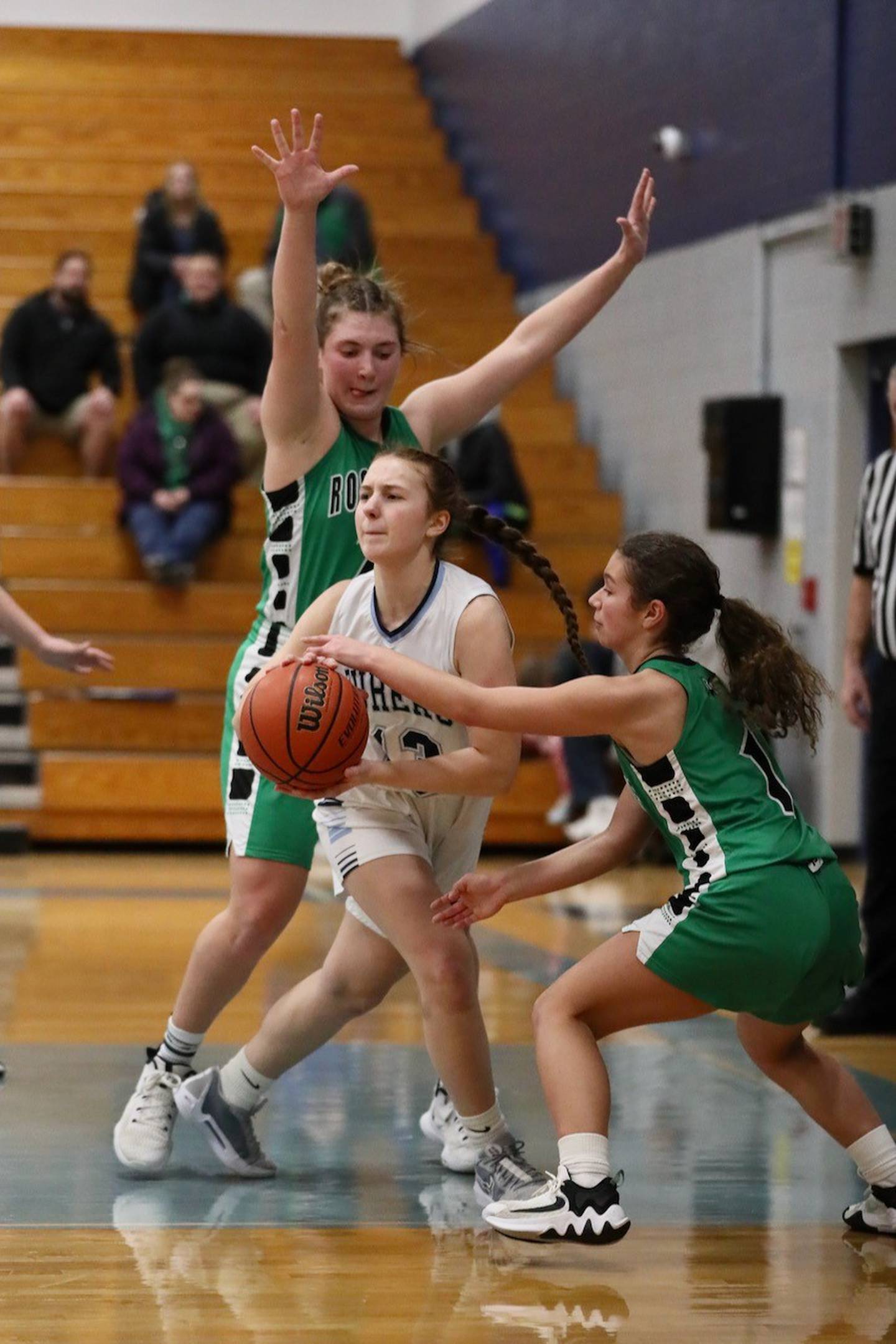 Bureau Valley's Libby Endress tries to pass away from Rock Falls' Rock Falls' Elizabeth Lombardo (1) and Claire Bickett in Saturday's regional game at the Storm Cellar.