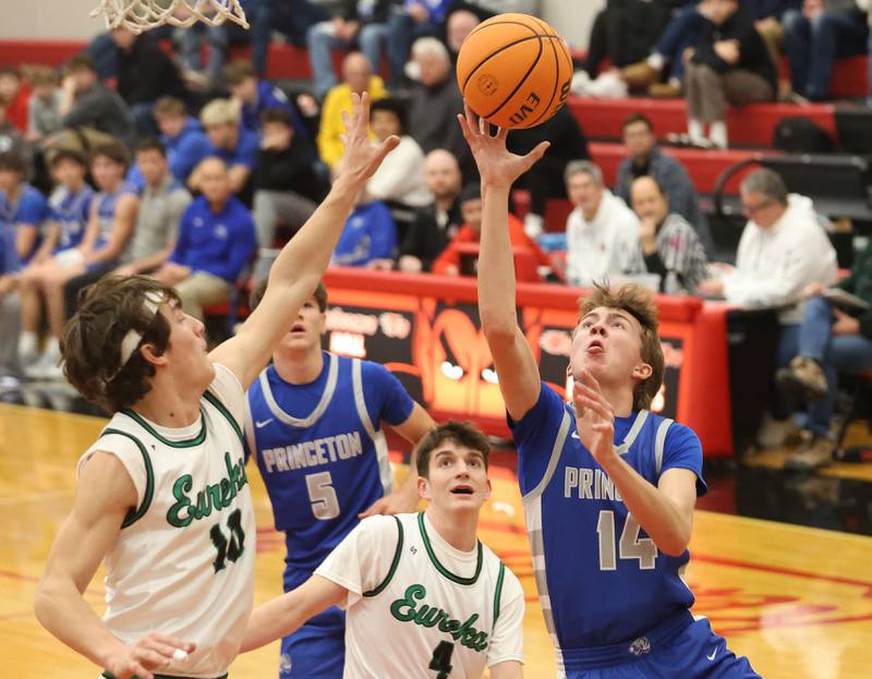 Princeton's Jackson Mason lets go of a shot over Eureka's Teagan McLaughlin during the Colmone Classic on Thursday, Dec. 11, 2025 at Hall High School.