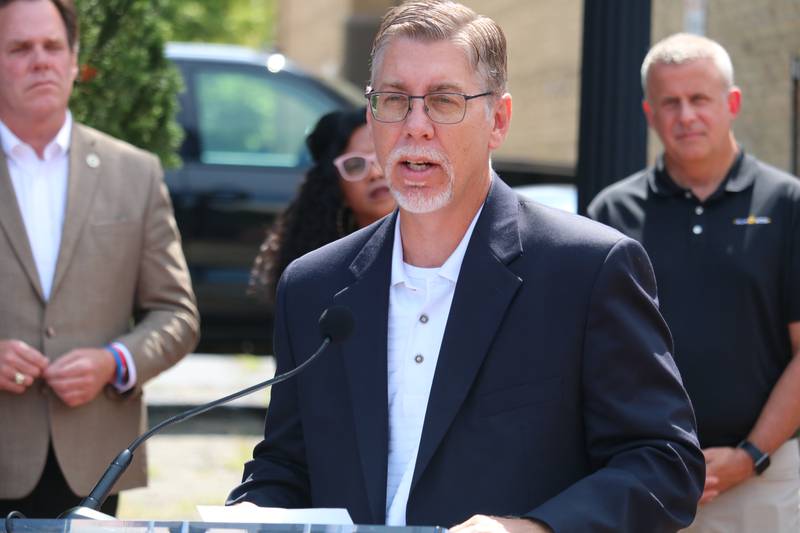 Matt Duffy, executive director for the DeKalb Chamber of Commerce, gives remarks during an Aug. 2, 2022 press conference. The event also featured a ribbon cutting to celebrate the completion of an electric vehicle charging station in the city's downtown.