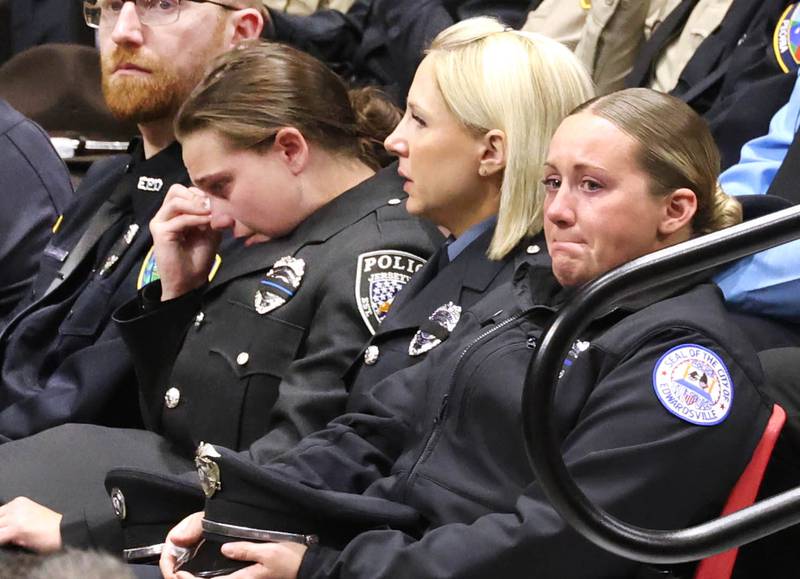 Members of law enforcement become emotional Thursday, April 4, 2024, during the visitation and funeral for DeKalb County Sheriff’s Deputy Christina Musil in the Convocation Center at Northern Illinois University. Musil, 35, was killed March 28 while on duty after a truck rear-ended her police vehicle in Waterman.