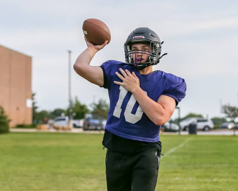 Tristan Meszaros passes at Plano High School football practice. Aug 20 2024.