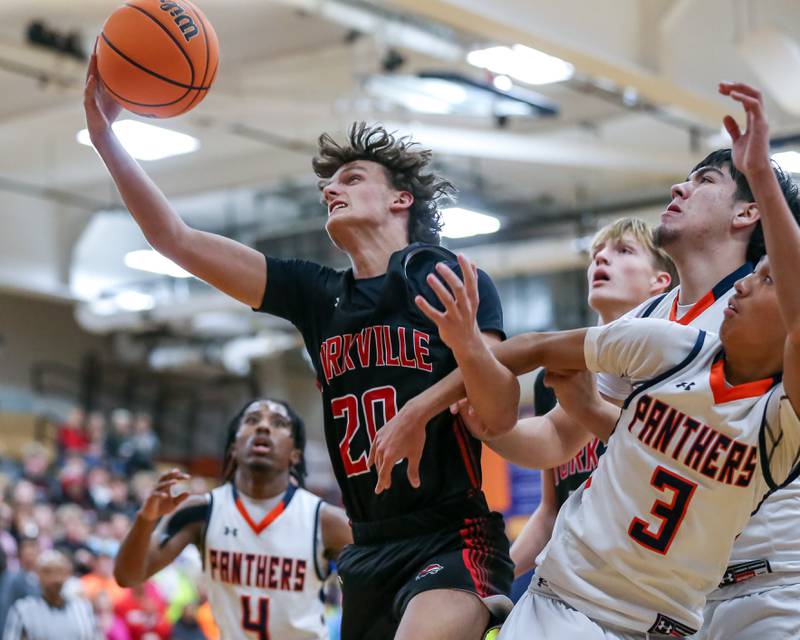 Yorkville's Anthony DiVito (20) grabs a rebound during their basketball game between Yorkville at Oswego, Tuesday Dec 10, 2024 in Oswego.