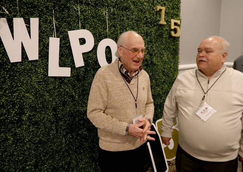 Former WLPO personalities Lanny Slevin and Rick Sipovic mingle during the WLPO 75th Anniversary party on Wednesday, Nov. 16, 2022 at Senicas Oak Ridge in La Salle.