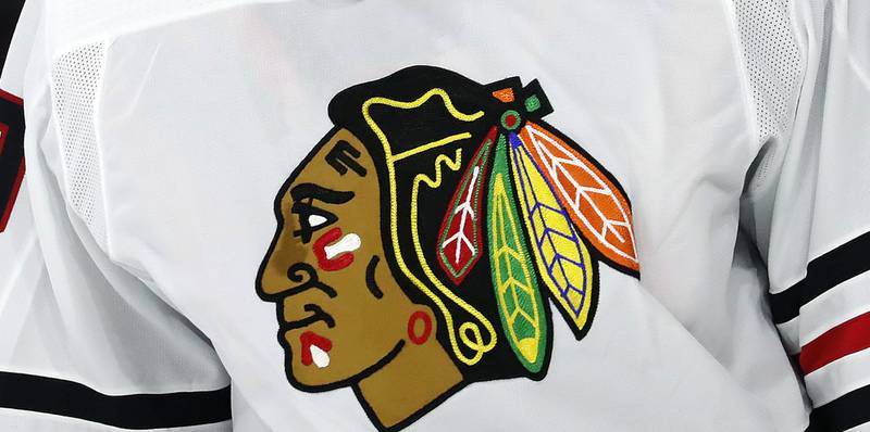 FILE  - The Chicago Blackhawks logo is shown on a jersey in Raleigh, N.C., in this May 3, 2021, file photo. The Chicago Blackhawks have hired a former federal prosecutor to conduct an independent review of allegations that a former player was sexually assaulted by a then-assistant coach in 2010. CEO Danny Wirtz announced the move in an internal memo Monday morning, June 28, 2021. (AP Photo/Karl B DeBlaker, File)