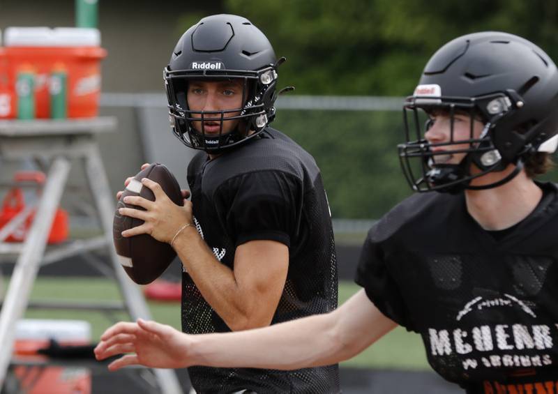 McHenry’s Jeff Schwab drops back to pass during football practice on Thursday, July 24, 2025, at McCracken Field, in McHenry.