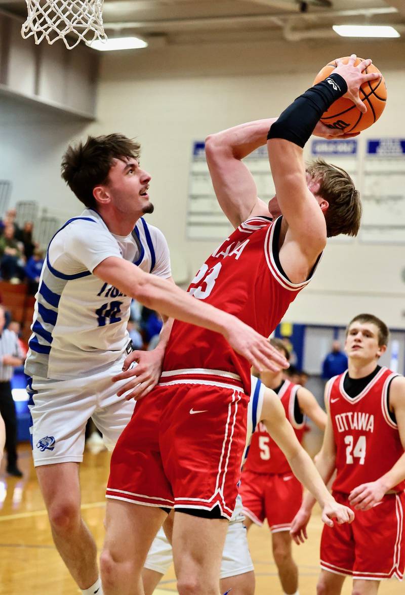 Princeton's Gavin Lanham defends Ottawa's Owen Sanders Tuesday night at Prouty Gym. The Pirates won 73-43.
