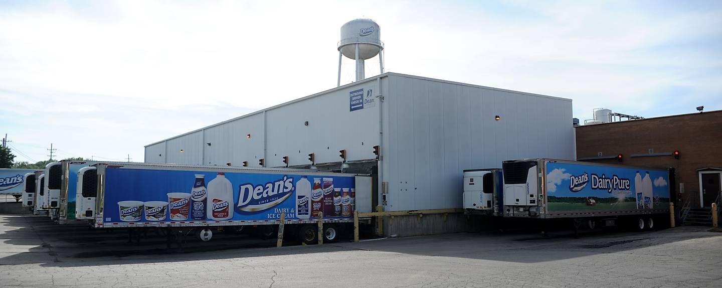 Refrigerated tractor trailers are parked Monday, May 30, 2022 at the loading dock of a former Dean Foods facility at 6303 Maxon Road near Harvard.