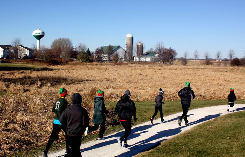 Runners begin a 5K race during the Huntley Rotary Club’s inaugural Running of the Elves at Betsey Warrington Park on Saturday, Dec. 3, 2022.