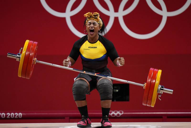 Tamara Yajaira Salazar Arce of Ecuador reacts after a successful lift, in the women's 87kg weightlifting event at the 2020 Summer Olympics, Monday, Aug. 2, 2021, in Tokyo, Japan.