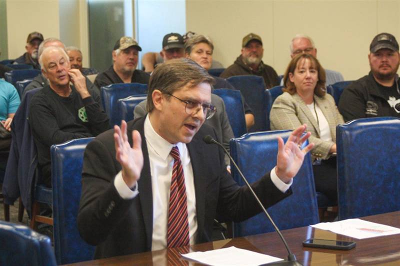 Gregory Magnuson, an Illinois resident, testifies at a public hearing Thursday in Springfield in opposition to proposed rules that would require owners of certain kinds of firearms to register them with the Illinois State Police to be able to legally keep them