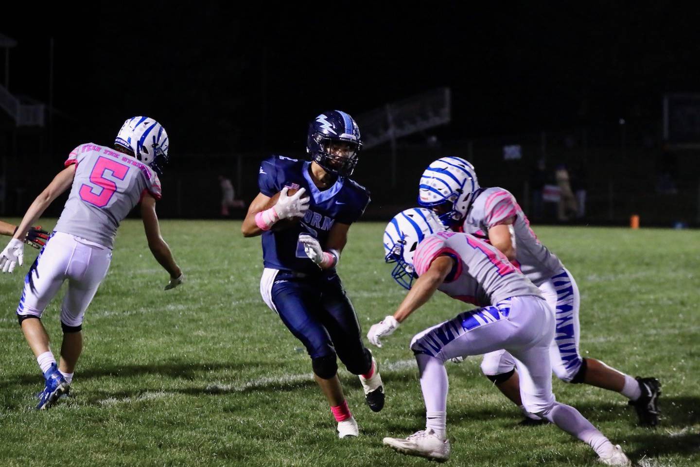 Bureau Valley's Corban Chhim tries to avoid Princeton tacklers Friday night.