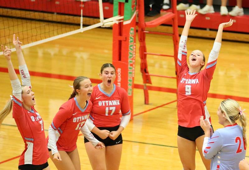 Members of the Ottawa volleyball team react after defeating L-P in three sets on Tuesday, Oct. 17, 2023 at Sellett Gymnasium.