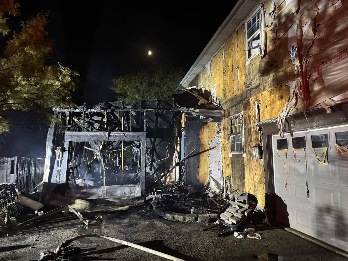 No one was injured in a garage fire in Oswego Oct. 11 that spread to a neighbor’s house.