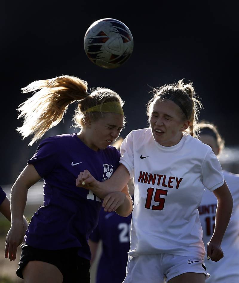 Huntley's Alex Szydlowski heads the ball in front of Huntley's Brooke Grabs during a Fox Valley Conference soccer game on Tuesday, April 23, 2024, at Hampshire High School.