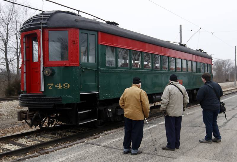 People look at aa 1928 Pullman Coach Saturday, Jan. 21, 2023, as the Illinois Railway Museum celebrates its 70 anniversary with the first of many celebrations by commemorating the 60 years since the abandonment of the Chicago North Shore and Milwaukee Railroad.