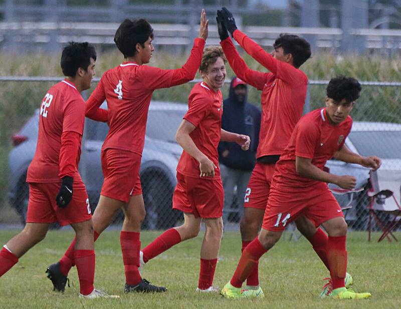 L-P's Jorge Martinez (4) hi-fives his teammate Rylee Hernandez after scoring a goal against Ottawa on Monday, Sept. 12, 2022 at the L-P Athletic Complex in La Salle.